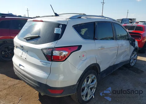 2018 Ford Escape Titanium z USA, uszkodzony, nr VIN 1FMCU0J95JUA71473